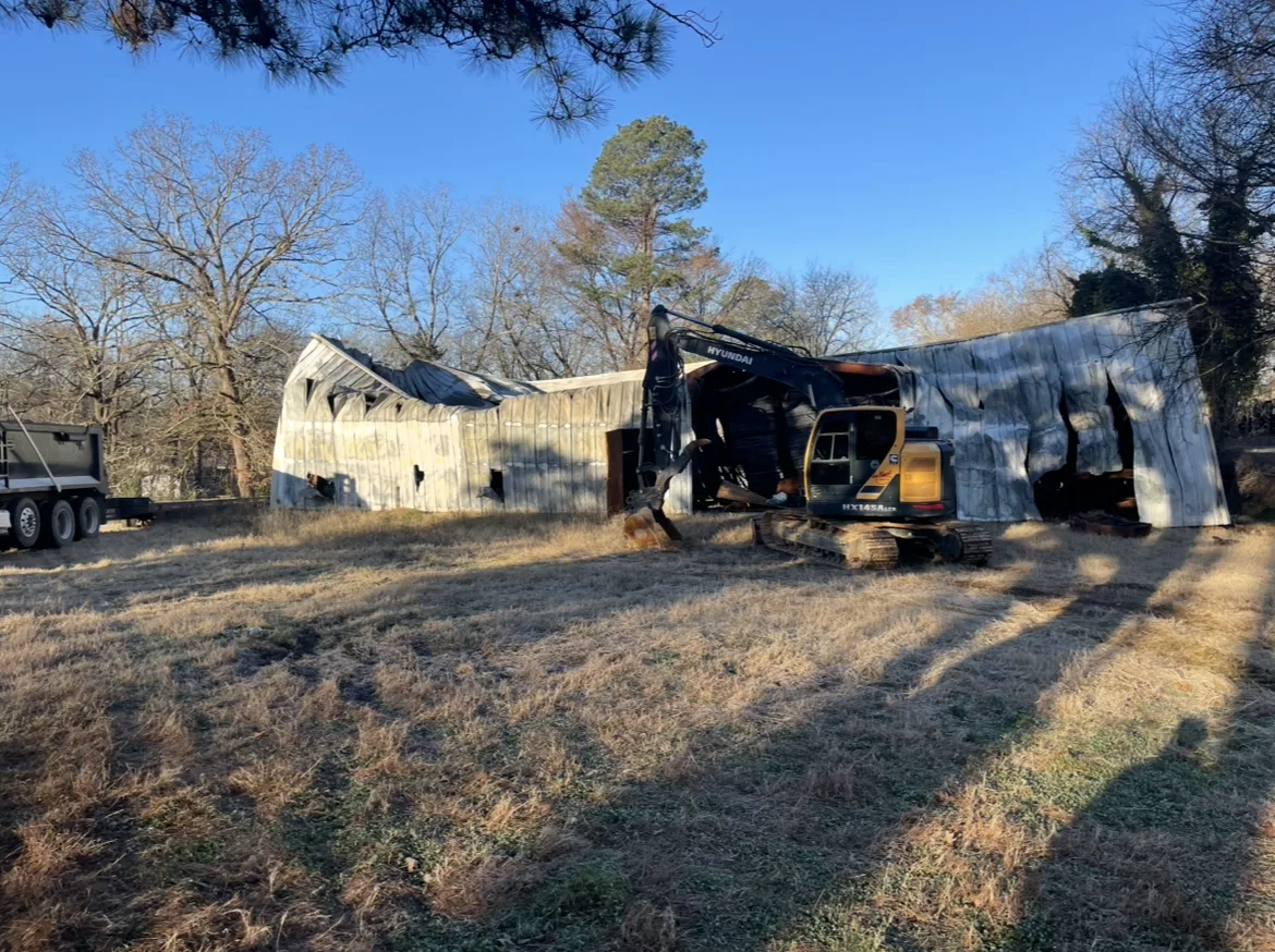 Residential structure coming down under control during a Hot Springs demolition